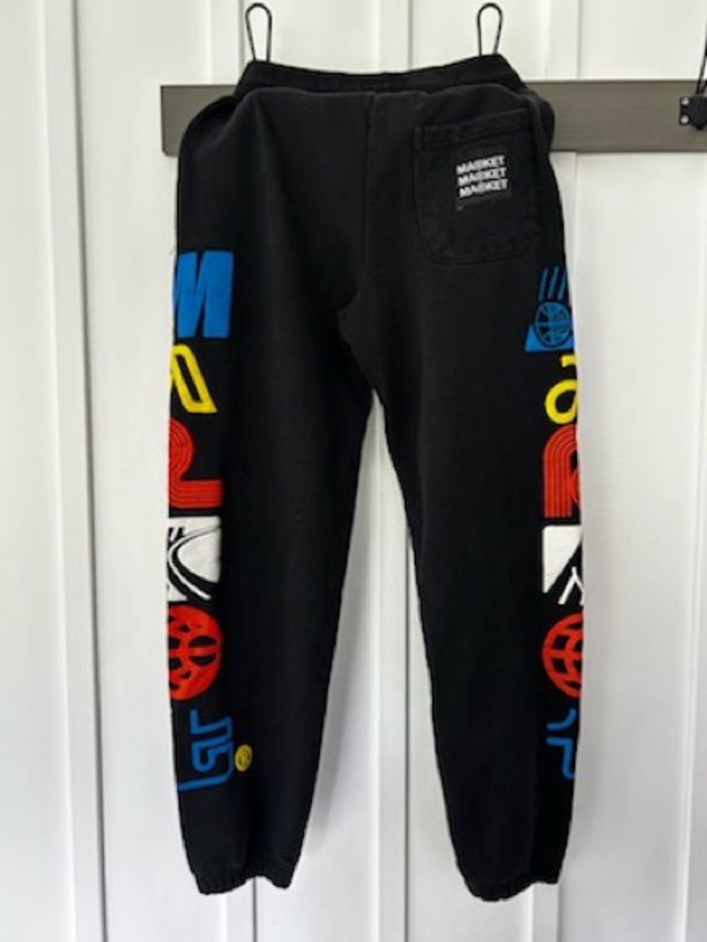 Market Black Graphic Joggers with Multicolor Logos